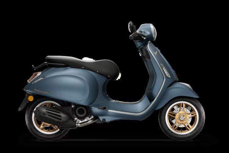 Blue vintage-style scooter on a black background, side view with gold wheels and black seat