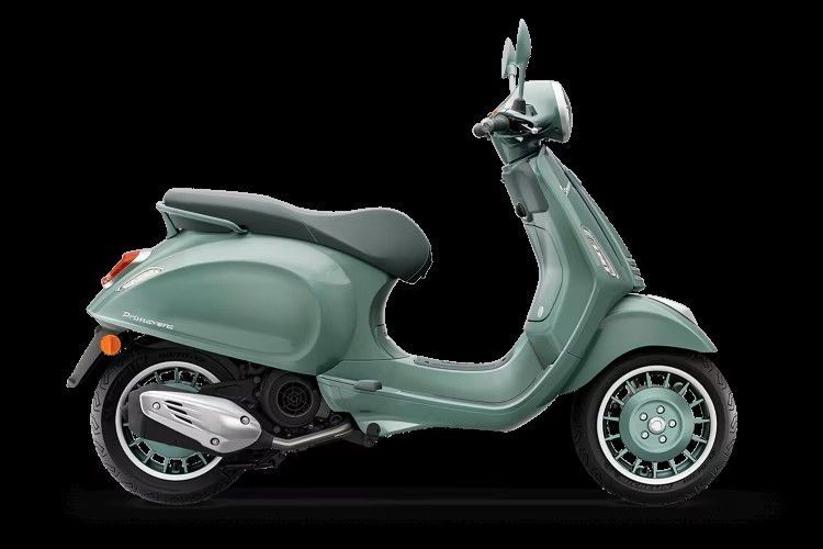 Mint green scooter in side view on a black background