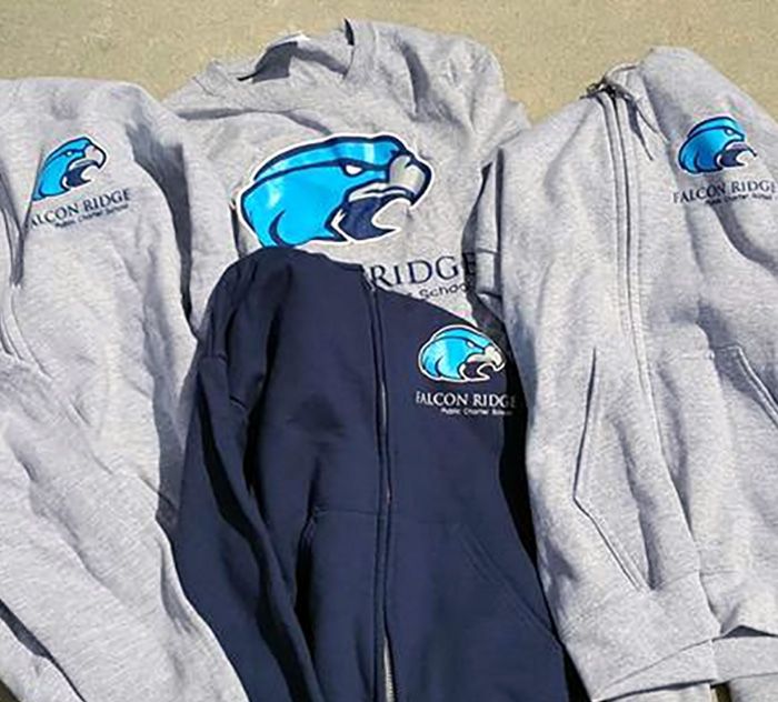 Falcon Ridge hoodies are stacked on top of each other