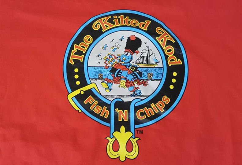 The Kilted Kod Fish N Chips logo on a red shirt