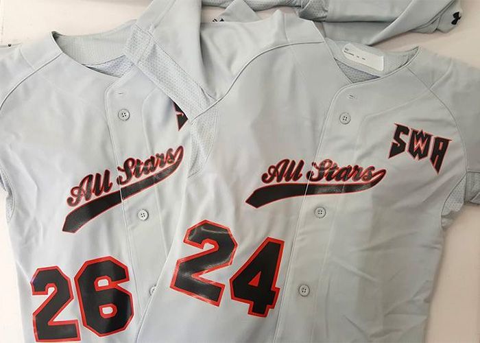 two baseball jerseys with the numbers 26 and 24 on them