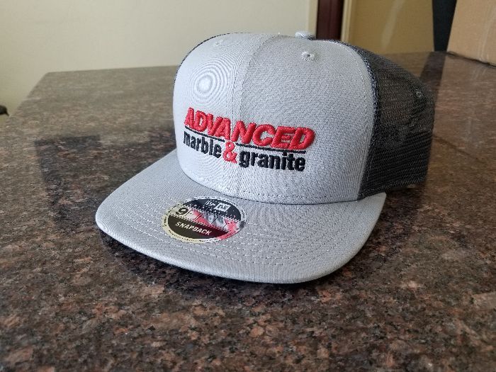 a baseball cap is sitting on top of a brown table