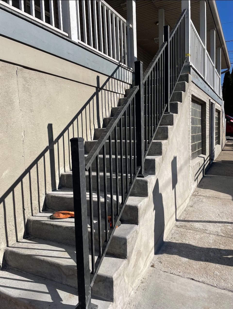 A set of stairs leading up to a building with a railing.