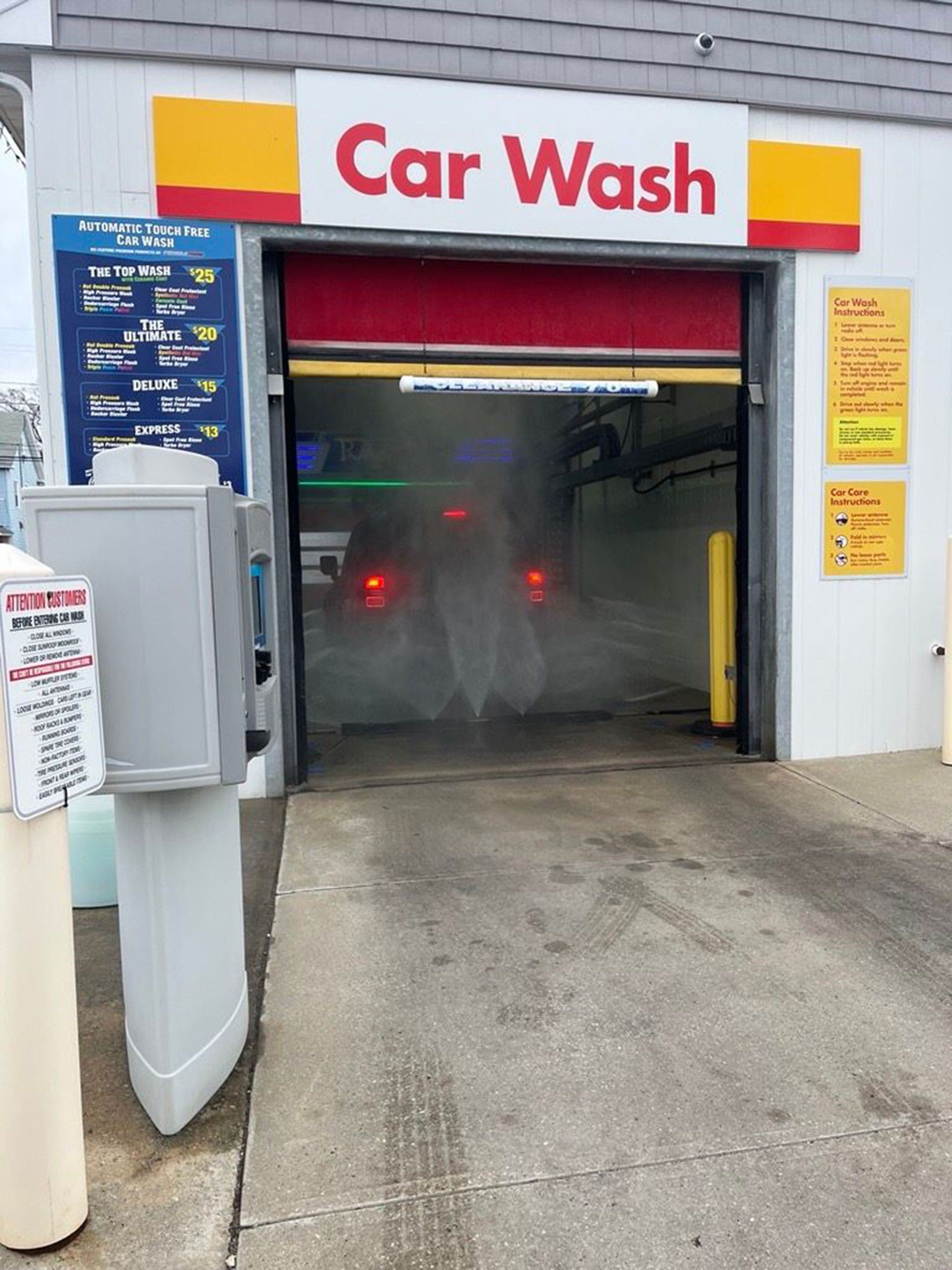 Touchless Car Wash - A car is being washed at a car wash.