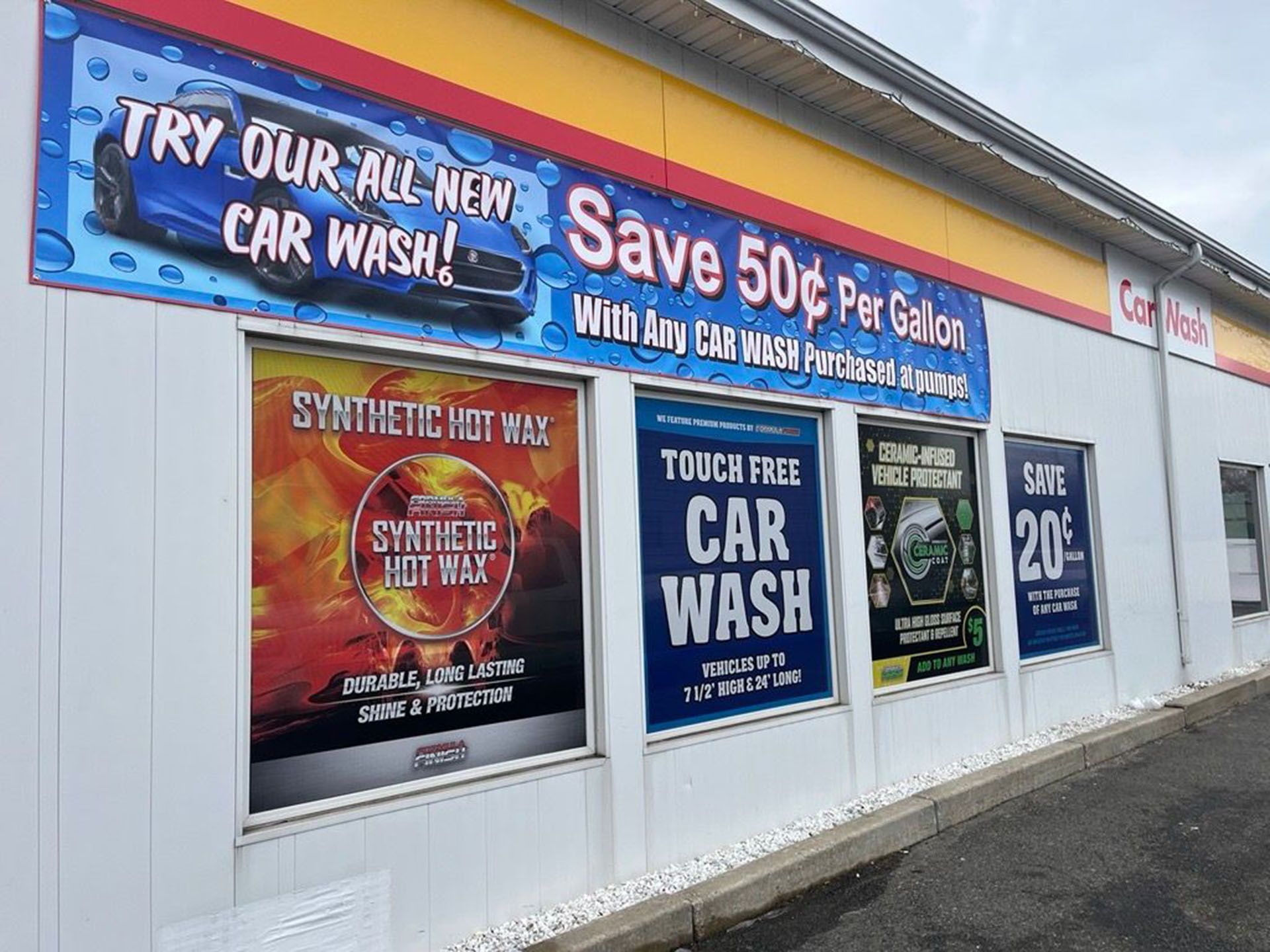 A car wash with a sign that says try our all-new car wash.