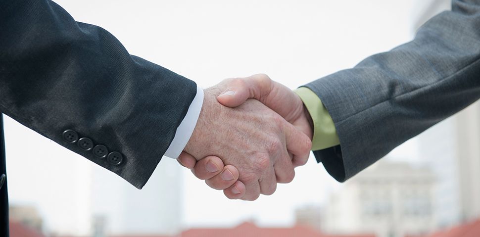 Two lawyers shaking hands