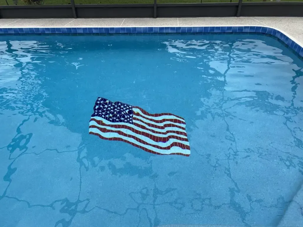 American flag floats in a blue pool.