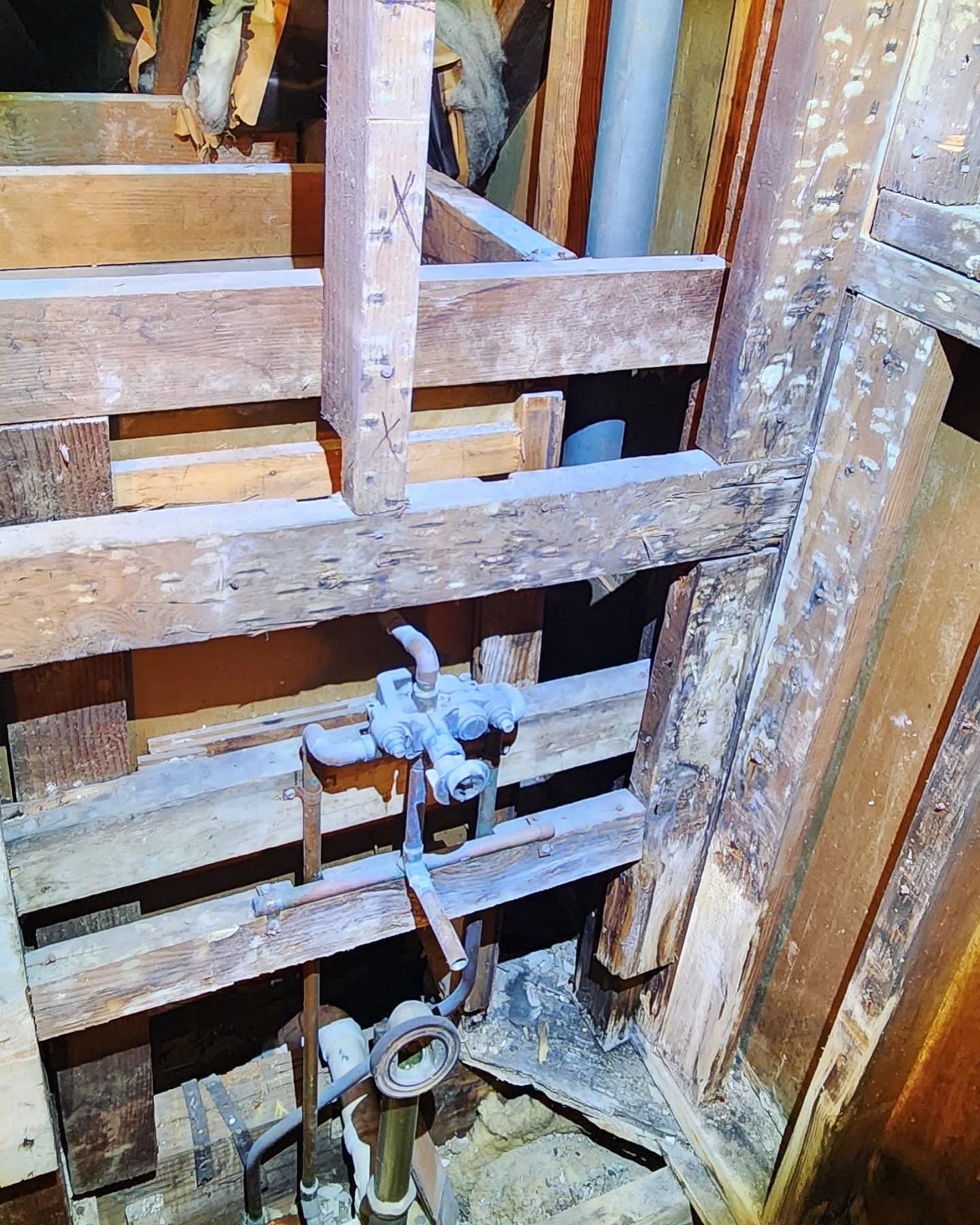 a wooden structure with a faucet in the middle of it