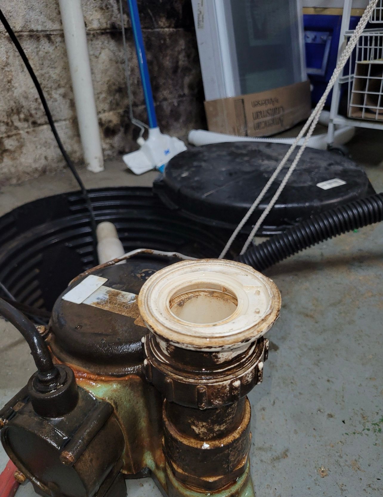 a close up of a water pump in a basement