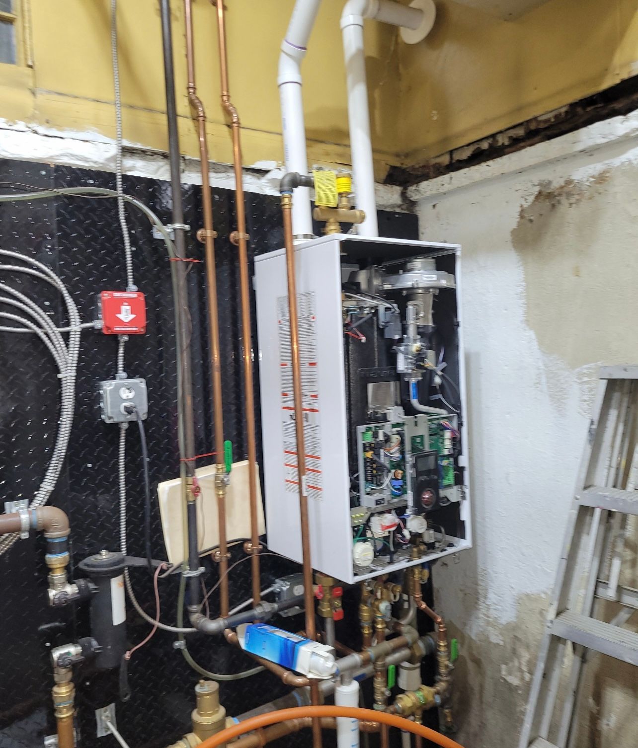 a water heater is being installed in a basement