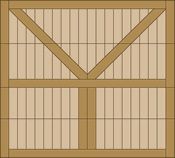 Wooden barn wall with vertical planks and a large V-shaped diagonal brace in the upper section.