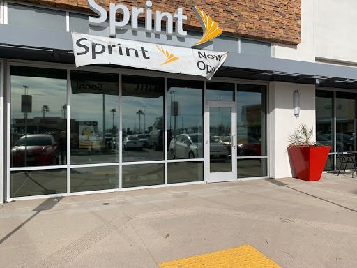 The front of a sprint store with a sign above the door.