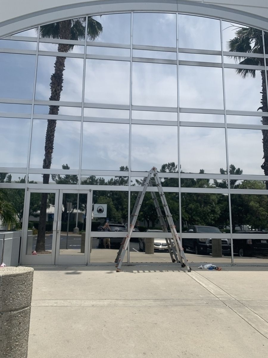 A large building with a ladder in front of it