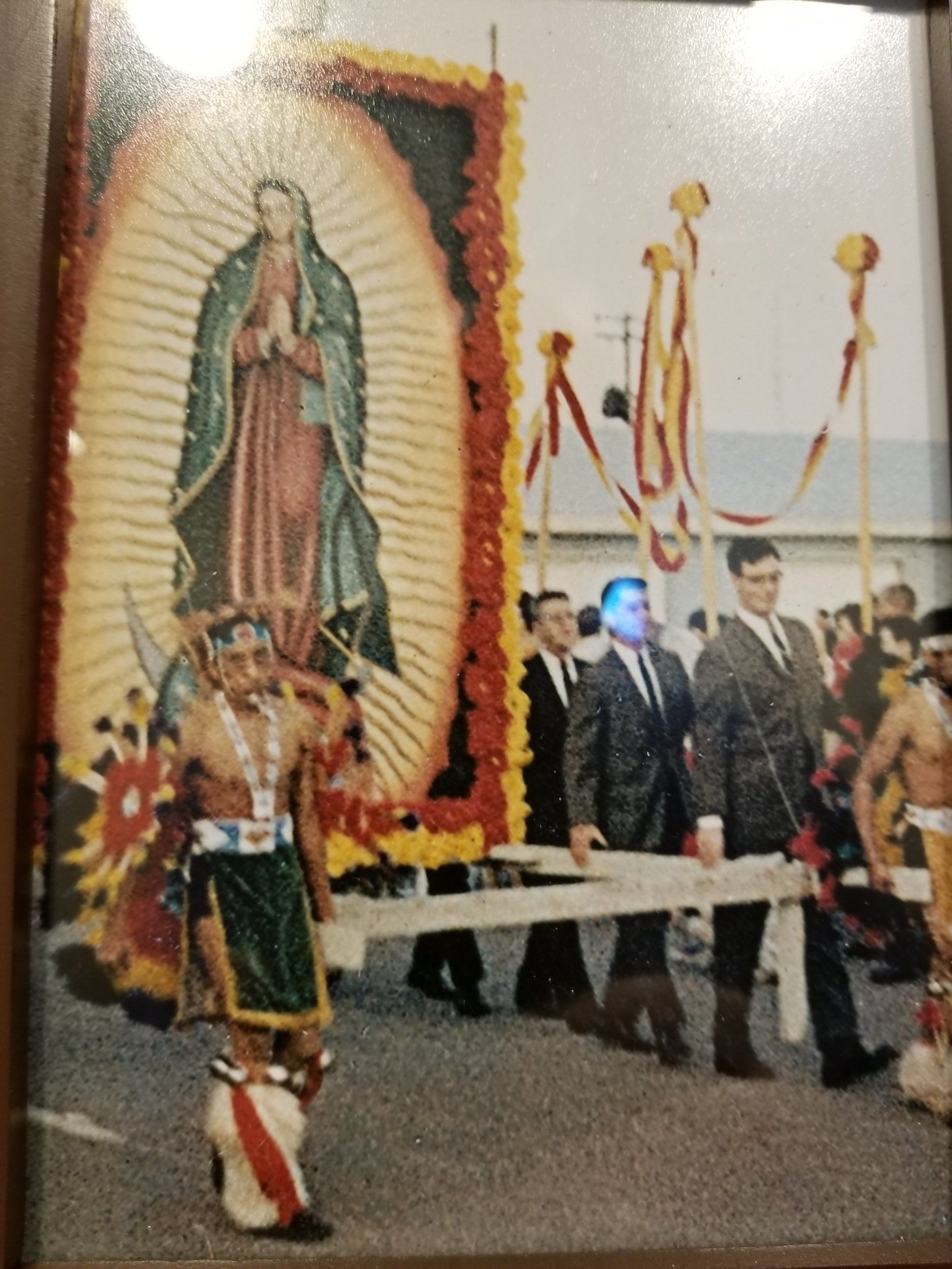 People parading religious image