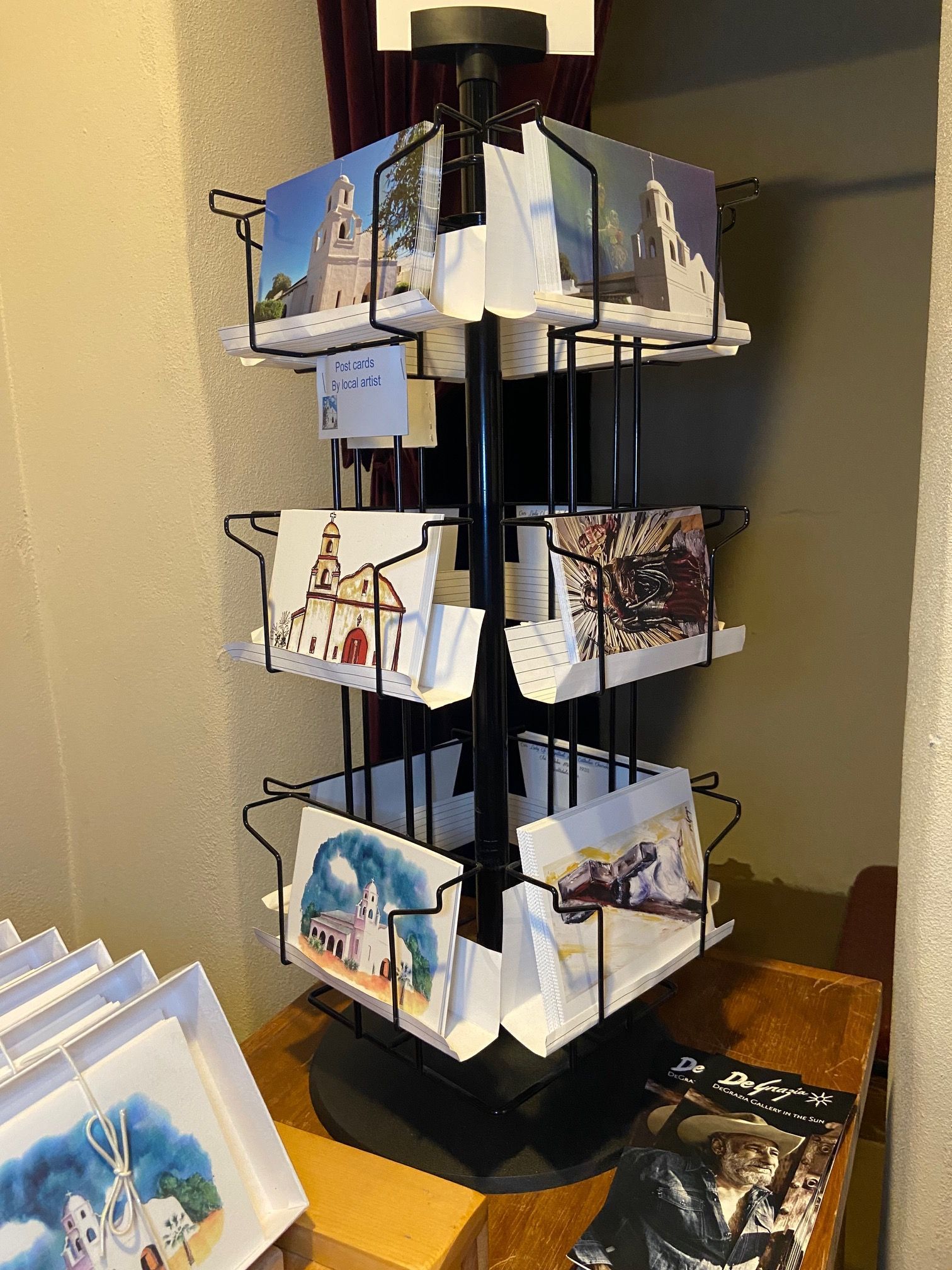 A display of postcards on a table in a room