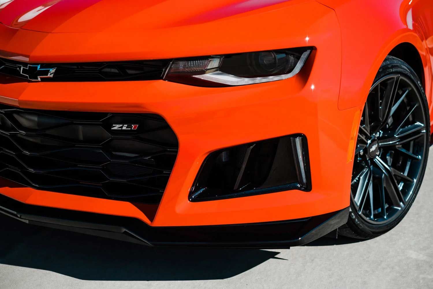 Orange Chevrolet Camaro ZL1 front end, black grill and wheels.