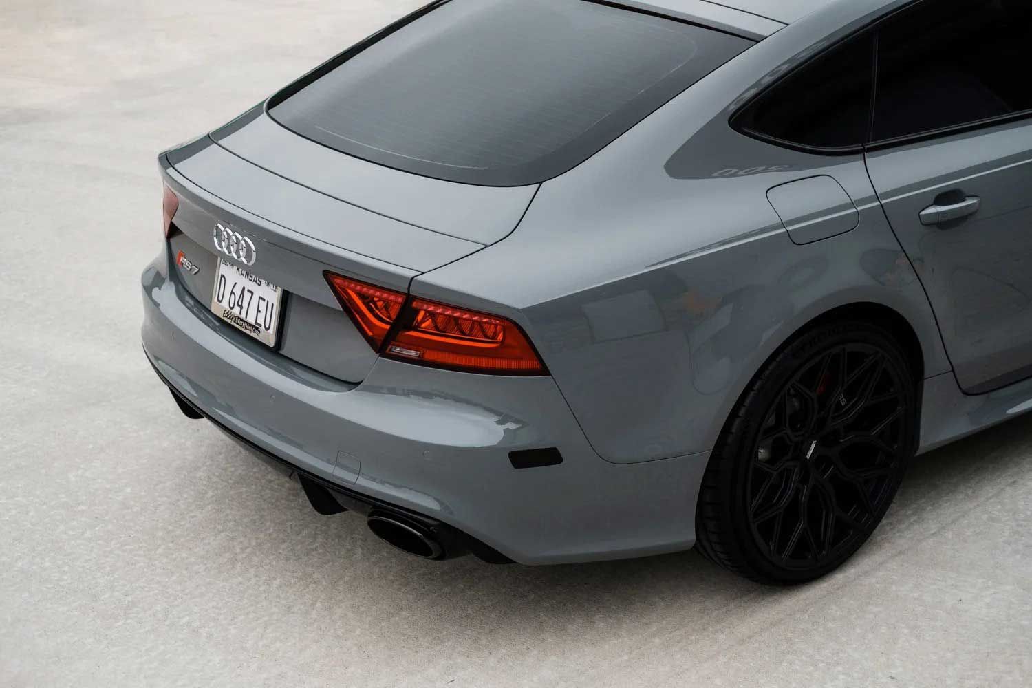 Gray Audi RS7 with black wheels and tinted windows.