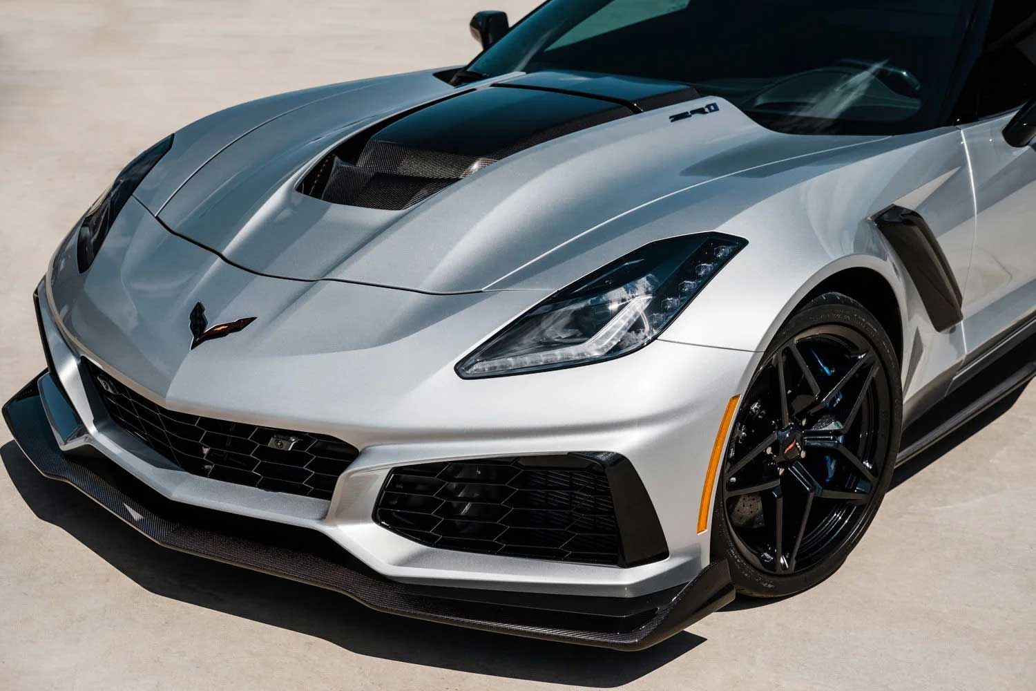 Silver Chevrolet Corvette ZR1 with black accents, front view.