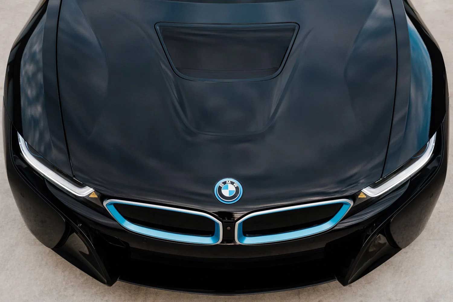 Black BMW i8 car hood with blue accents.