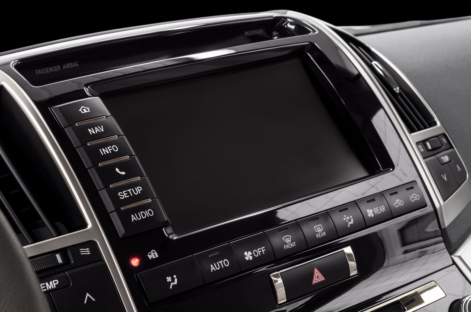 Car dashboard center console with touchscreen display and climate control buttons