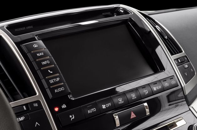Car dashboard center console with touchscreen display and climate control buttons
