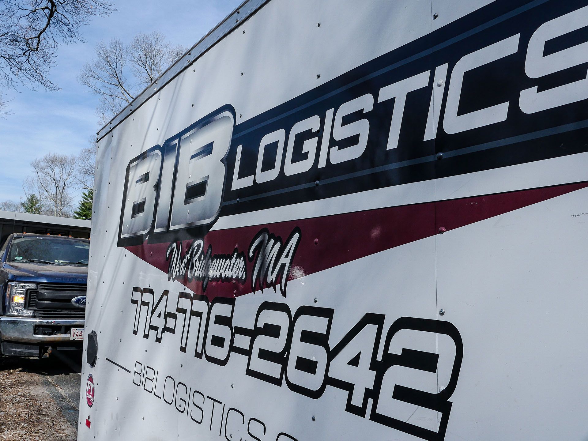 A white trailer with bib logistics written on it