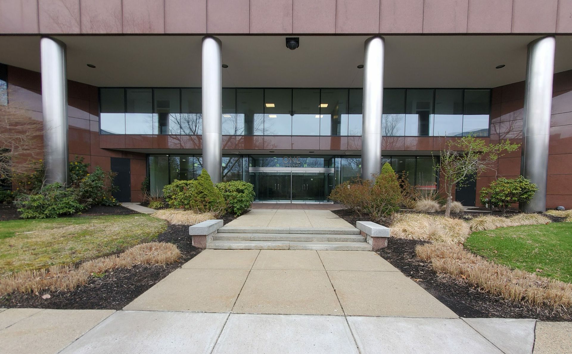 A large building with a walkway leading to it