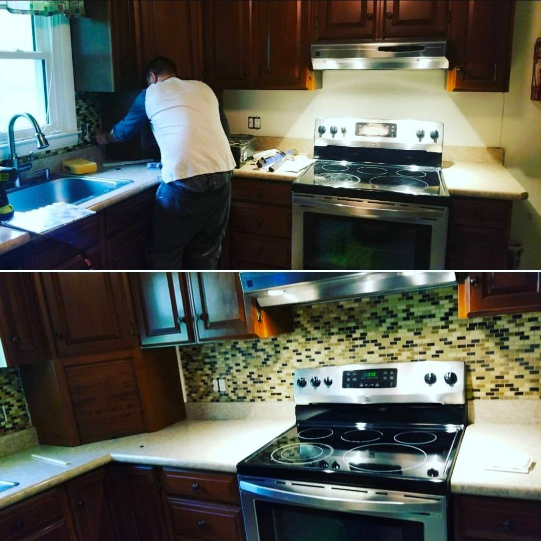 Kitchen renovation in progress: A person working on backsplash, before and after view.
