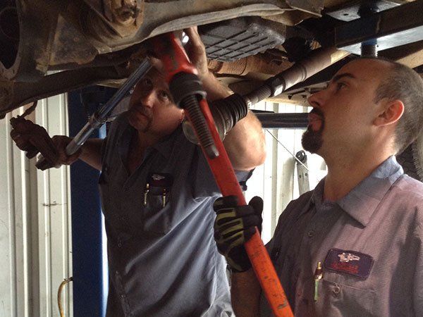 mechanics fixing car