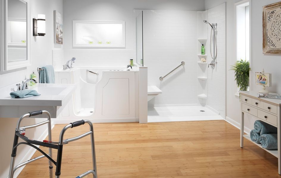 Accessible white bathroom with walk-in tub, shower, and walker.