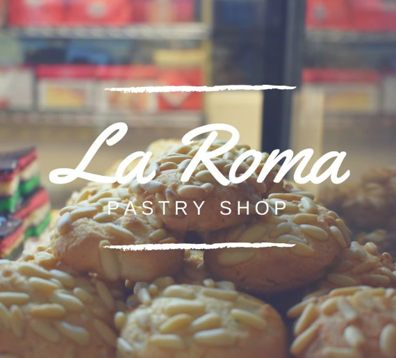 La Roma pastry shop logo over trays of baked goods in a bakery display
