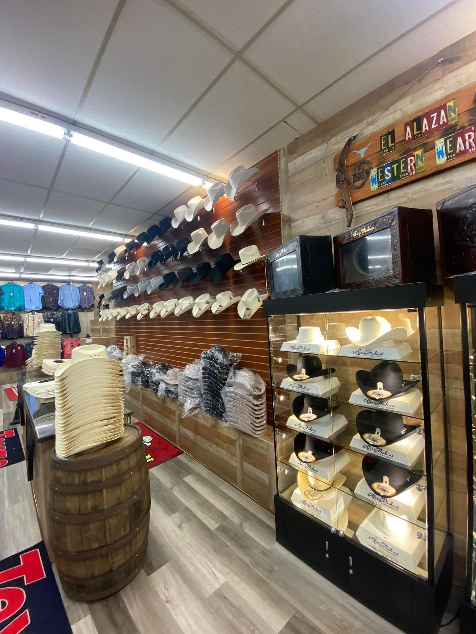 A store filled with lots of hats and a barrel.