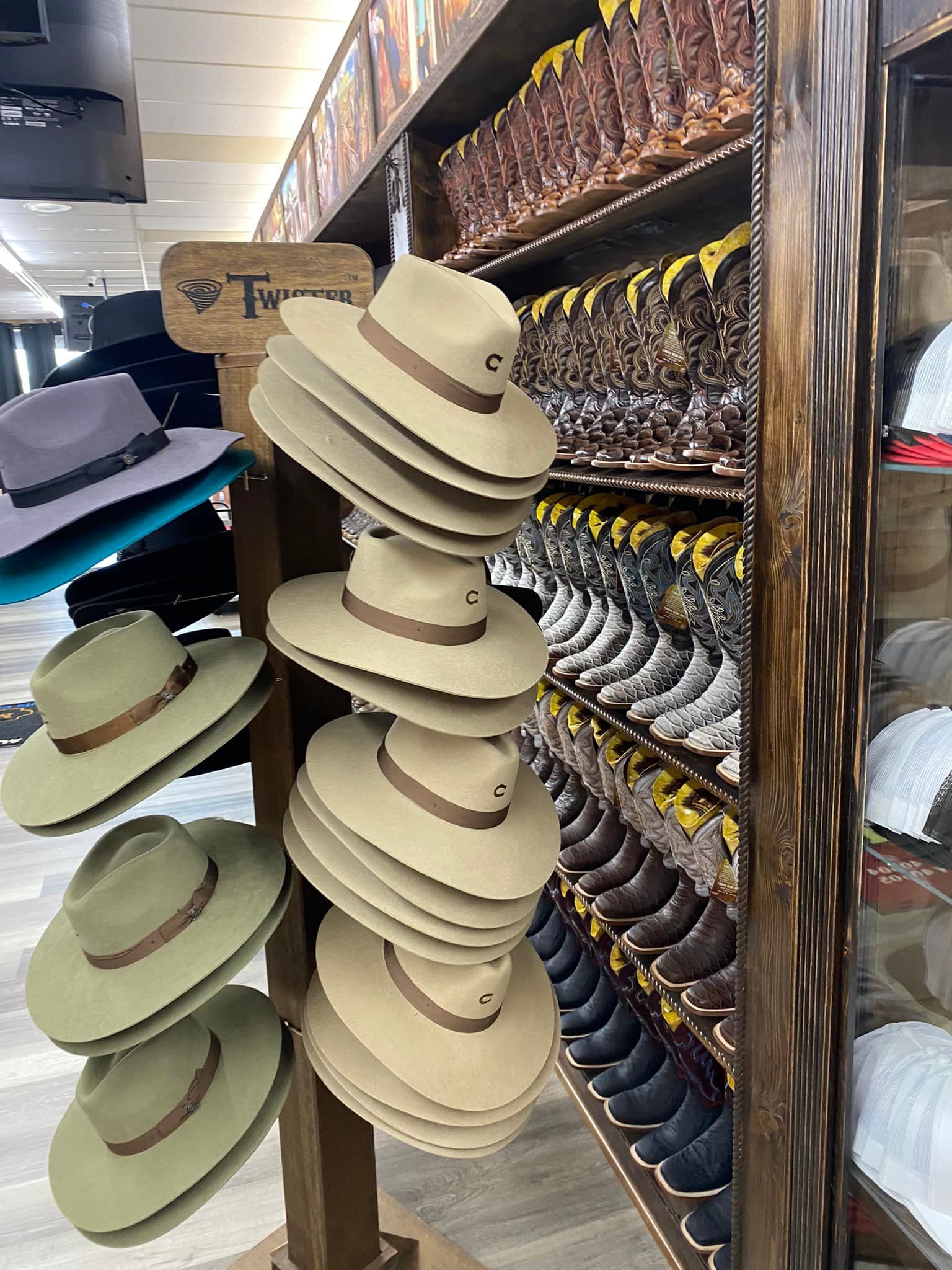 A display of hats and boots in a store.