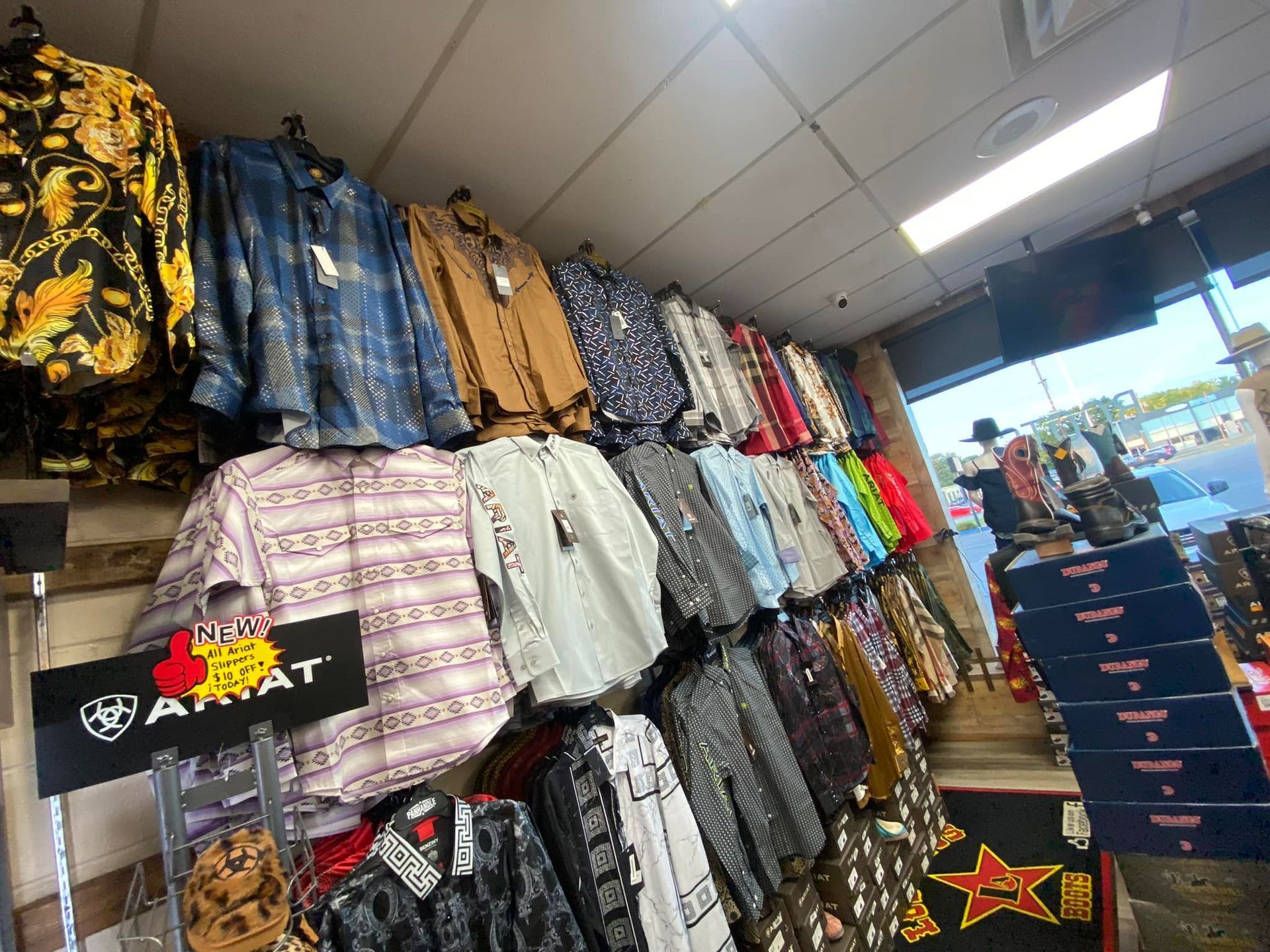 A store filled with lots of shirts and jackets.