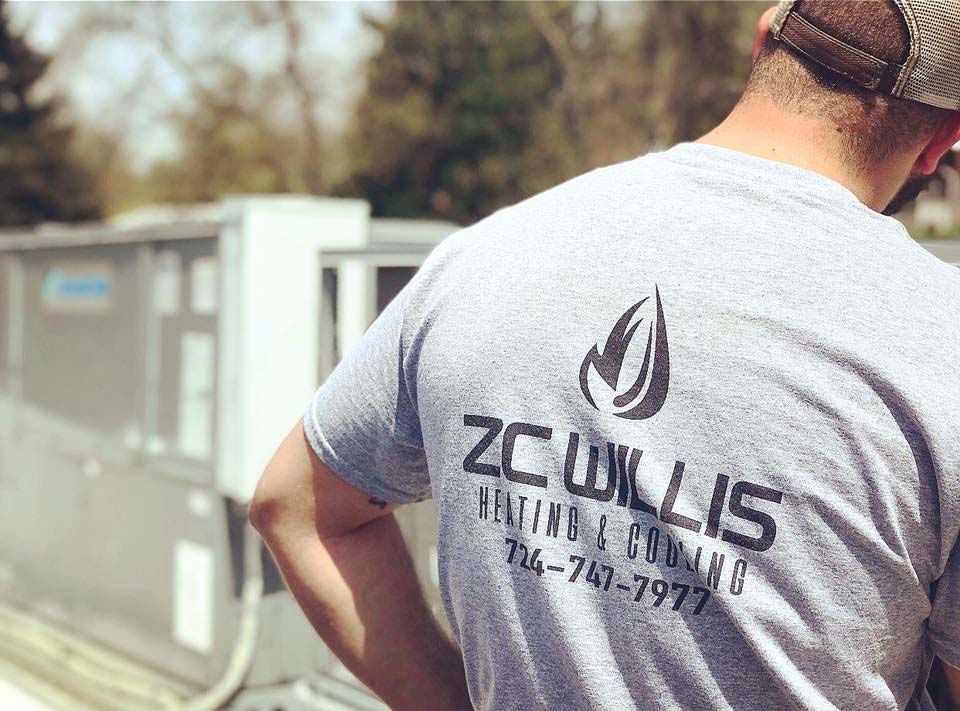 A person in a gray t-shirt with 