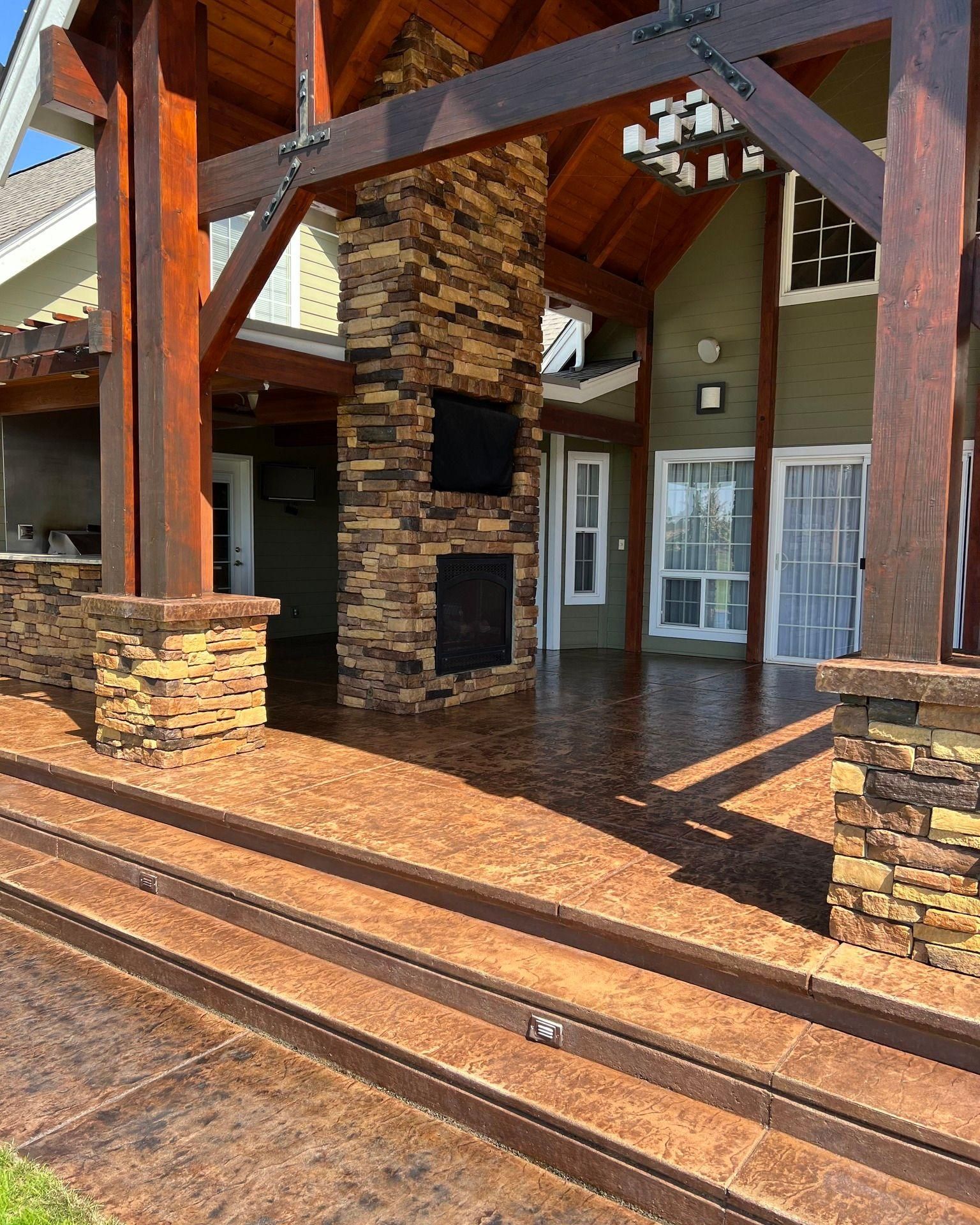 a large house with a stone fireplace and stairs