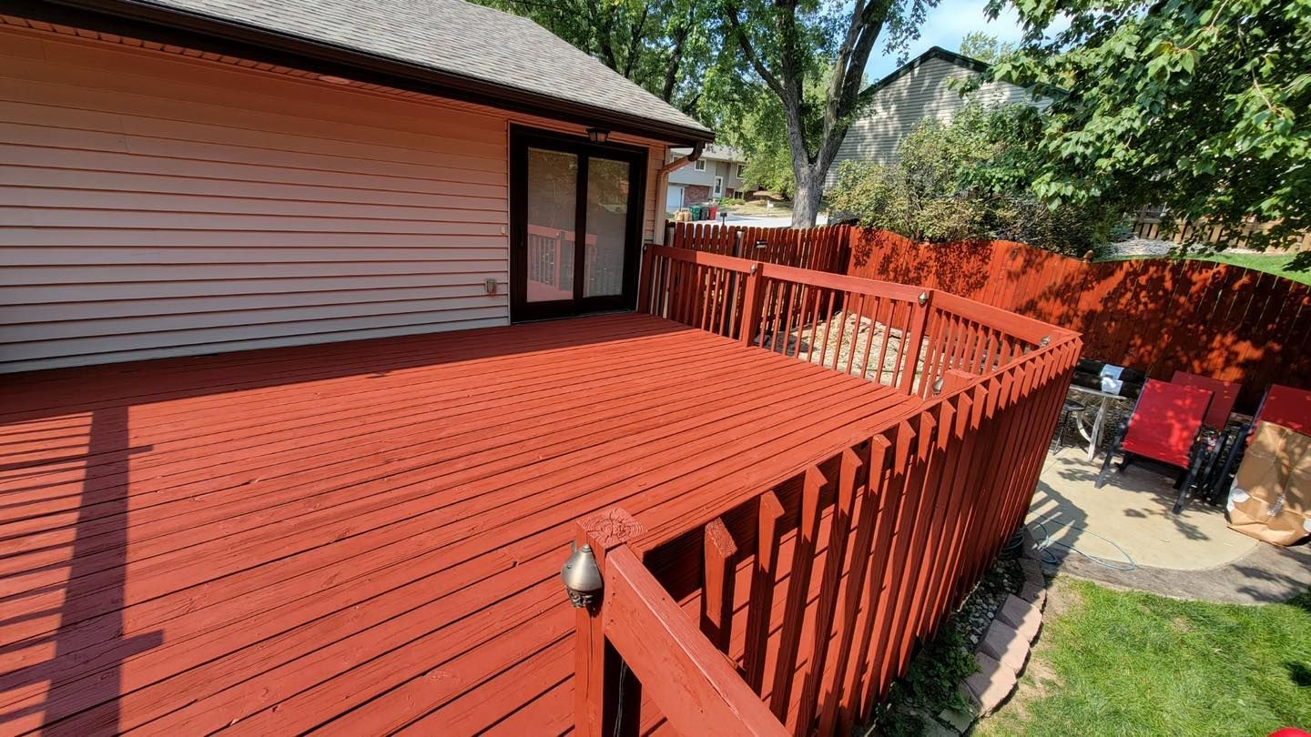 A house with a deck and kayaks on it.