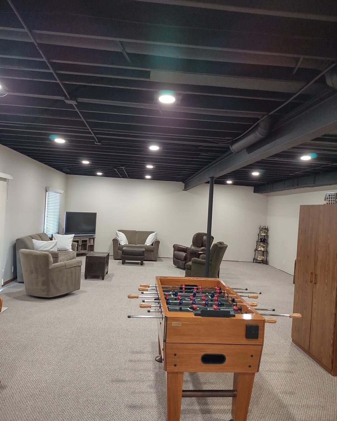 There is a foosball table in the middle of the room.