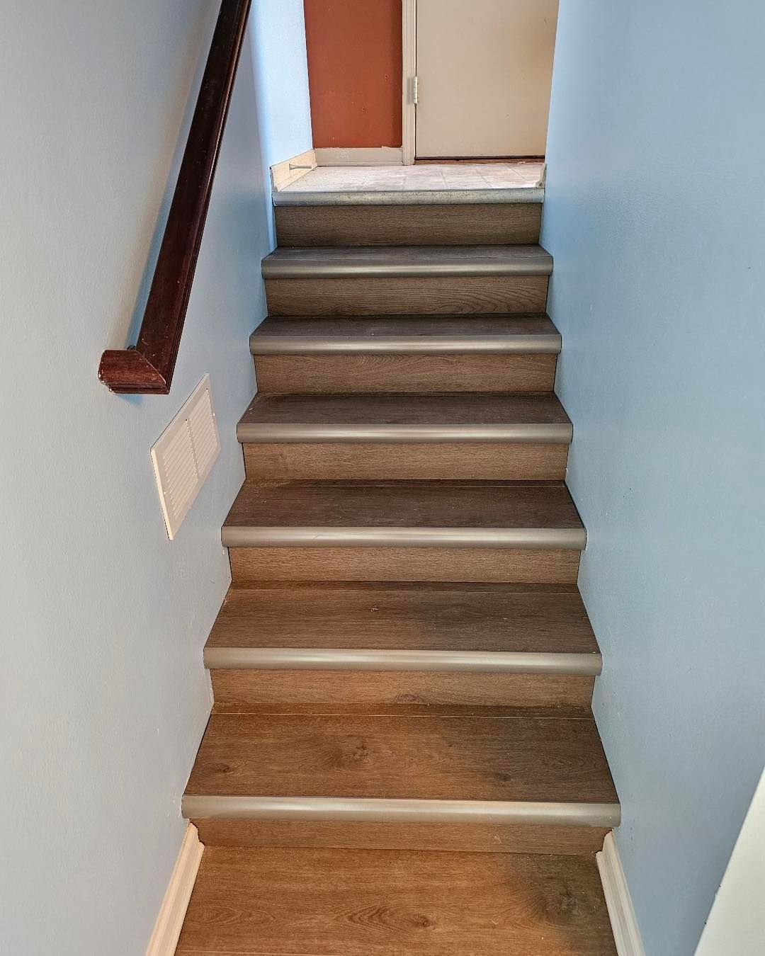 A set of stairs leading up to the second floor of a house.