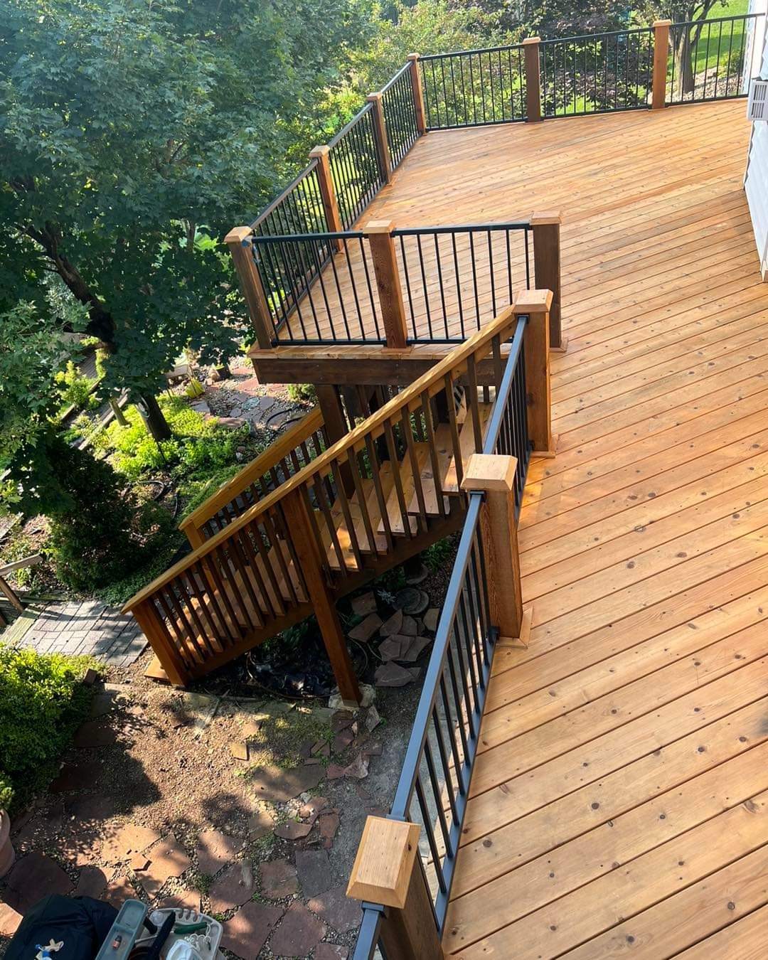 An aerial view of a wooden deck with stairs leading up to it.