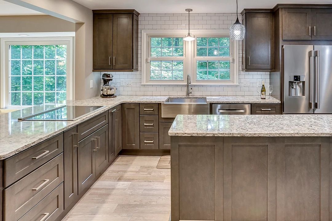 A kitchen with stainless steel appliances and granite counter tops