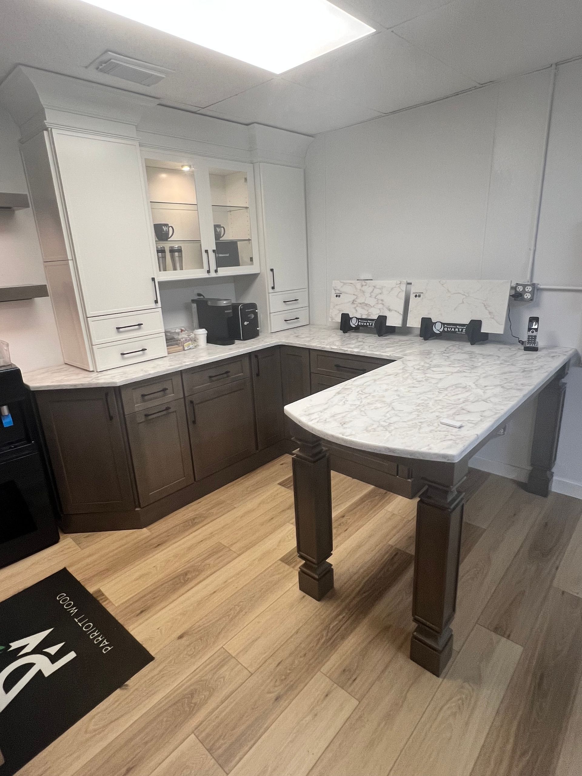 A kitchen with a large table in the middle of the room.