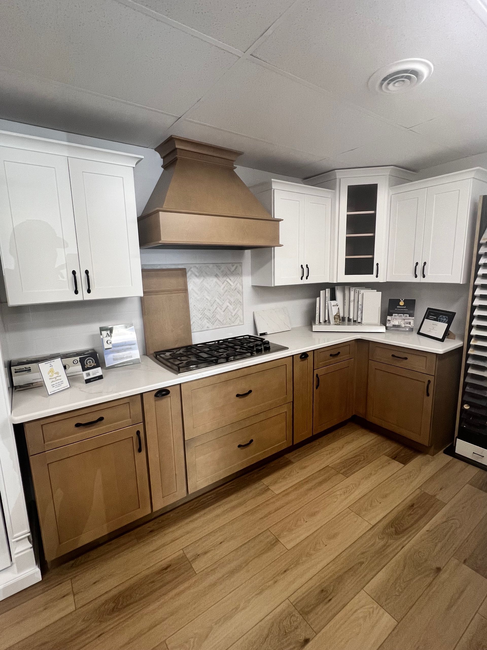 A kitchen with wooden cabinets and a stove top oven.