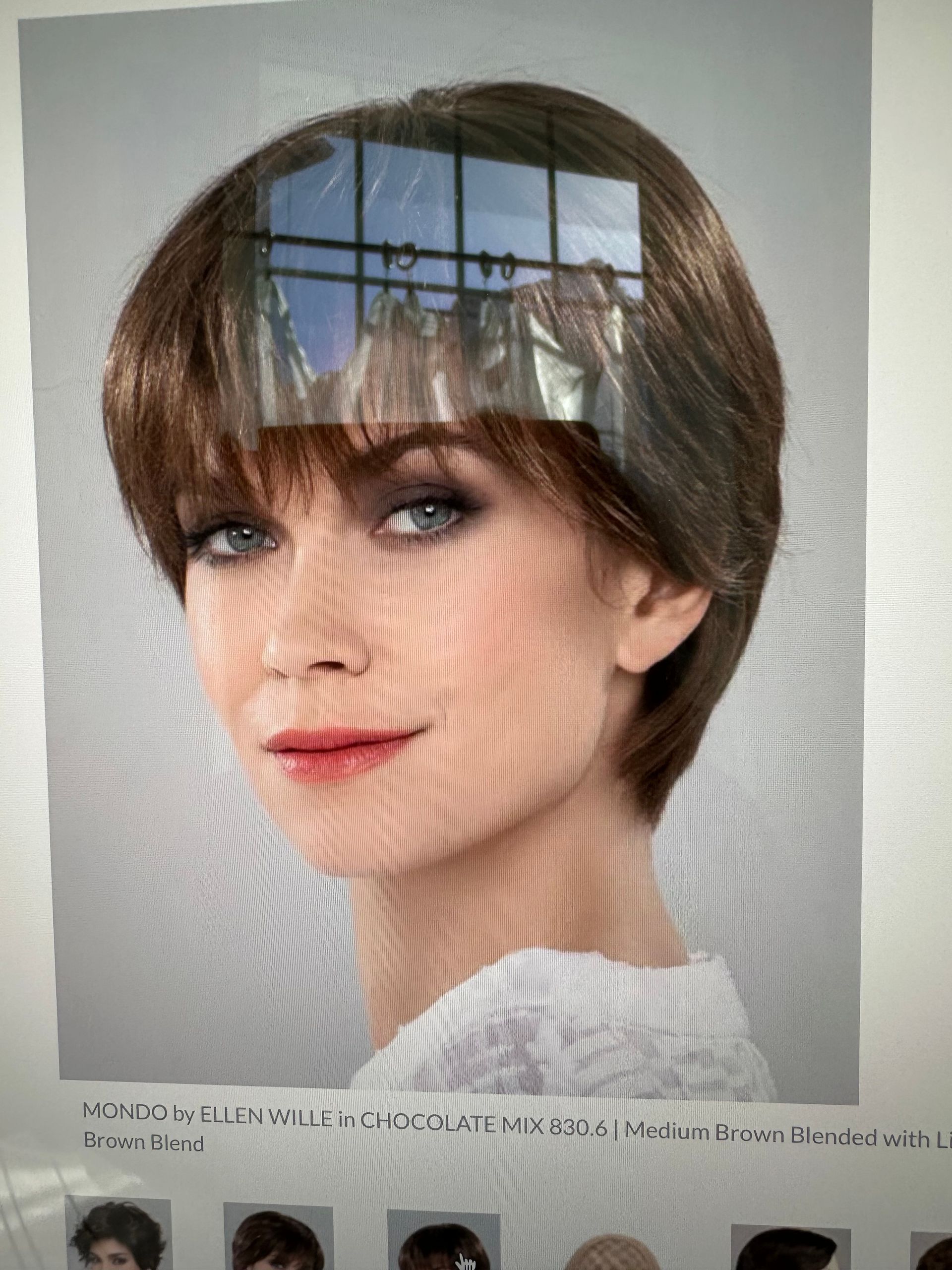 A close up of a woman 's face with a wig on.