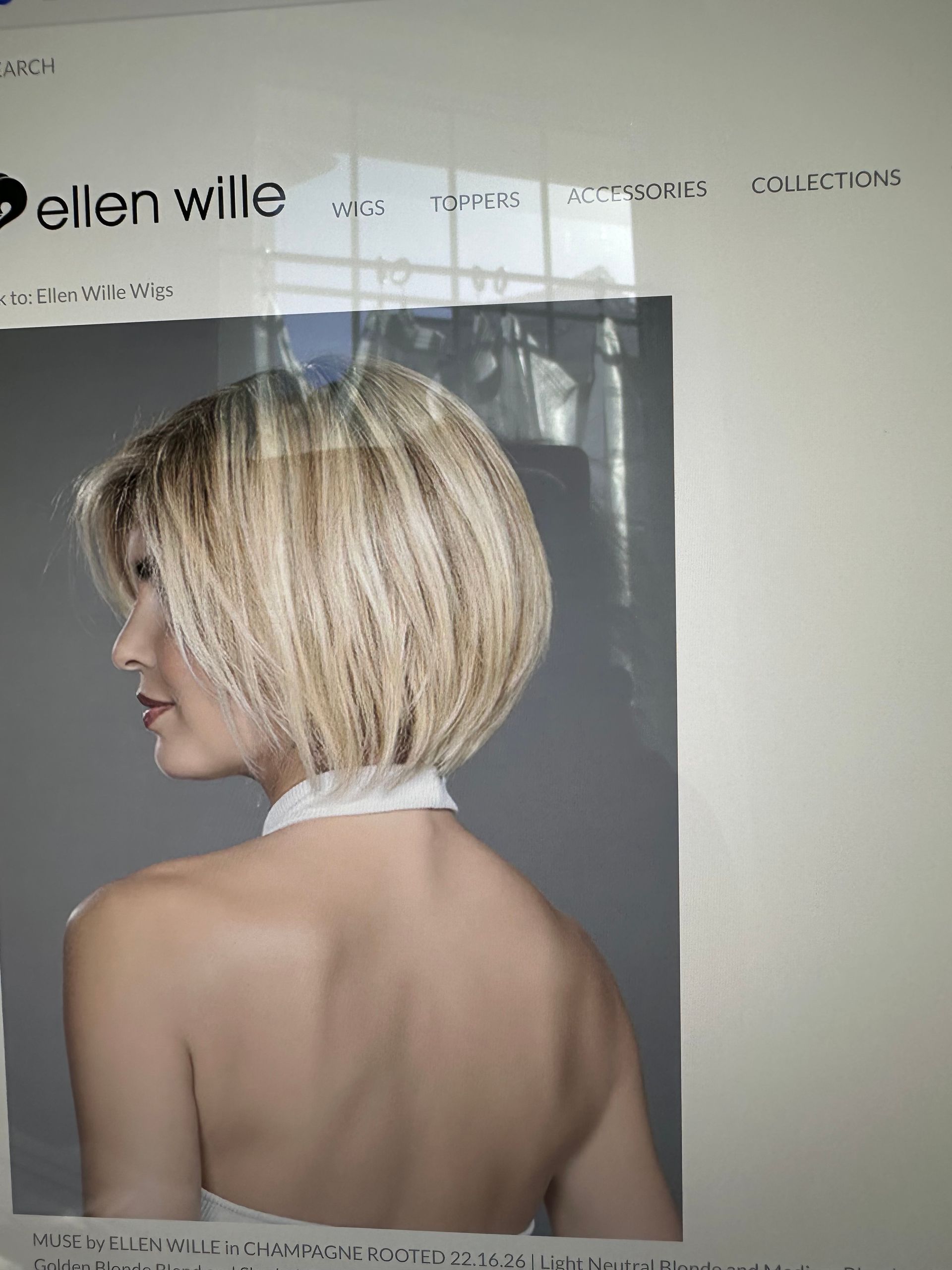 A picture of a woman with blonde hair and a white collar