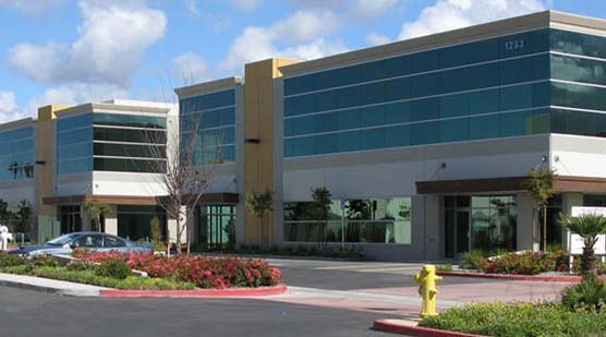 A large building with a fire hydrant in front of it.