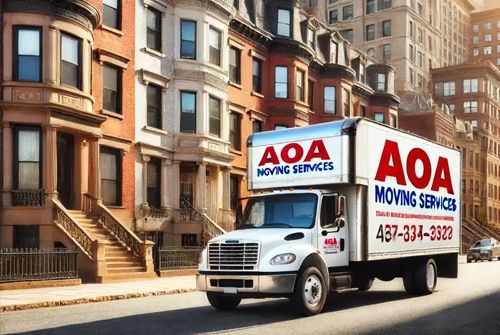 A white AOA moving services truck is driving down a city street.