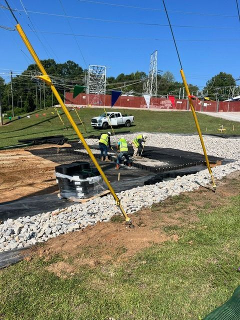 A group of construction workers are working on a construction site