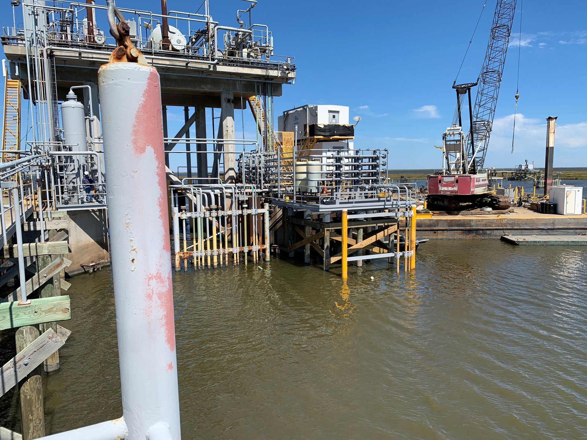 A large body of water with a building in the background