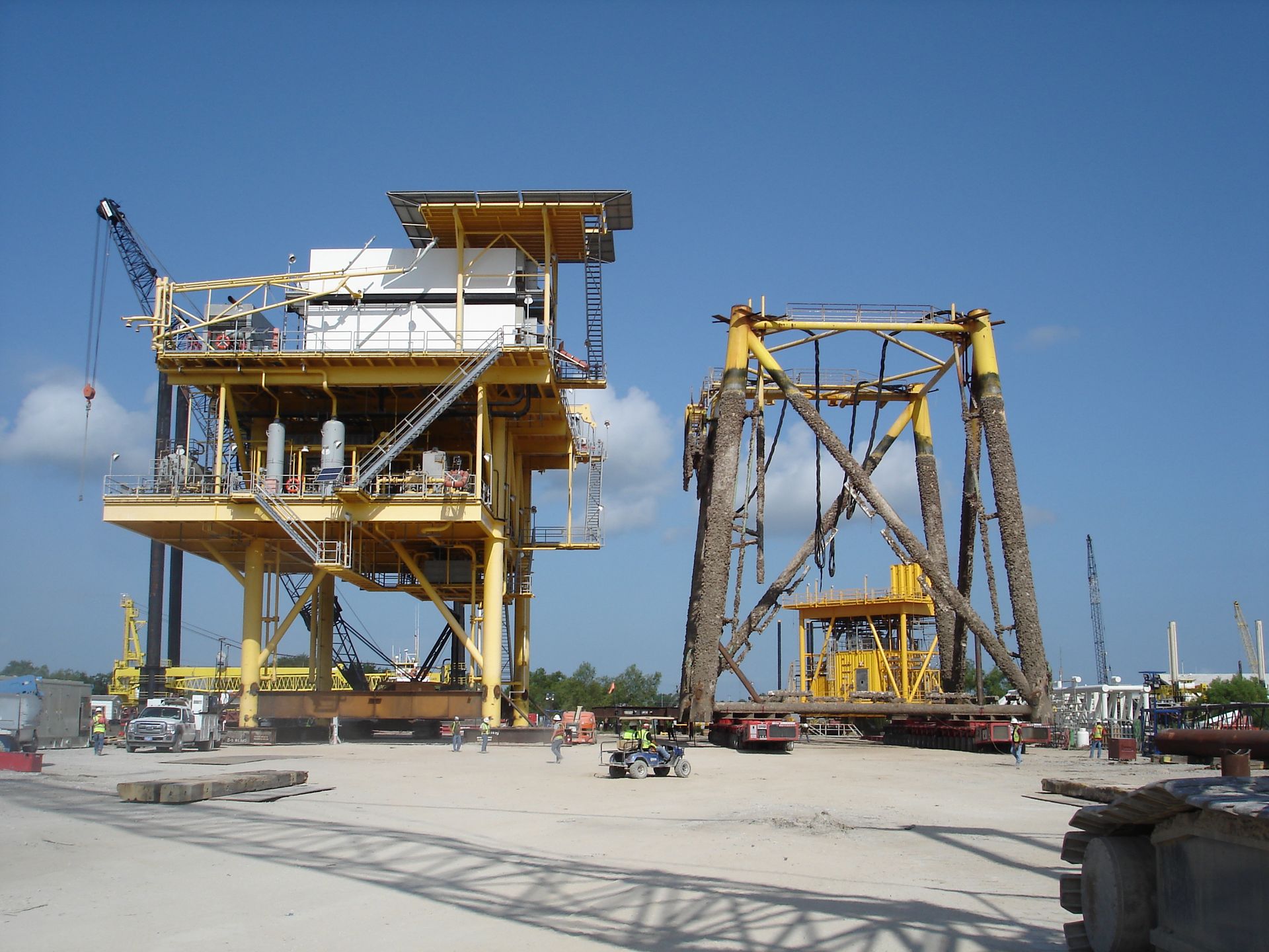A large yellow structure with a blue sky in the background